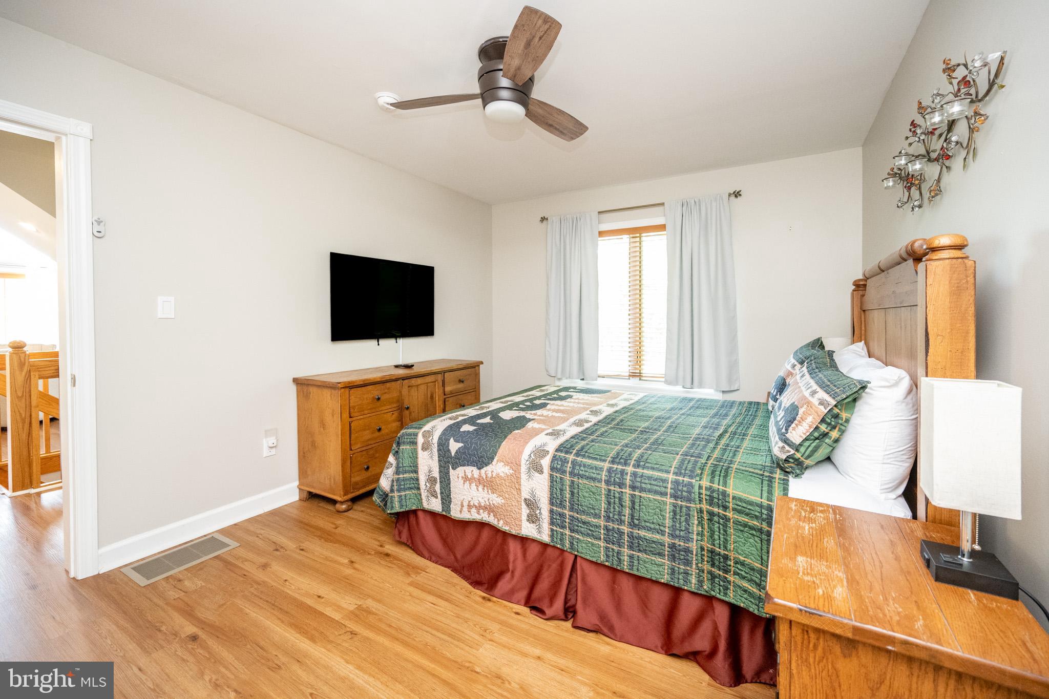 201 Rock Lodge Road McHenry, MD 21541 - Photo 29 of 75 a bedroom with a bed and tv