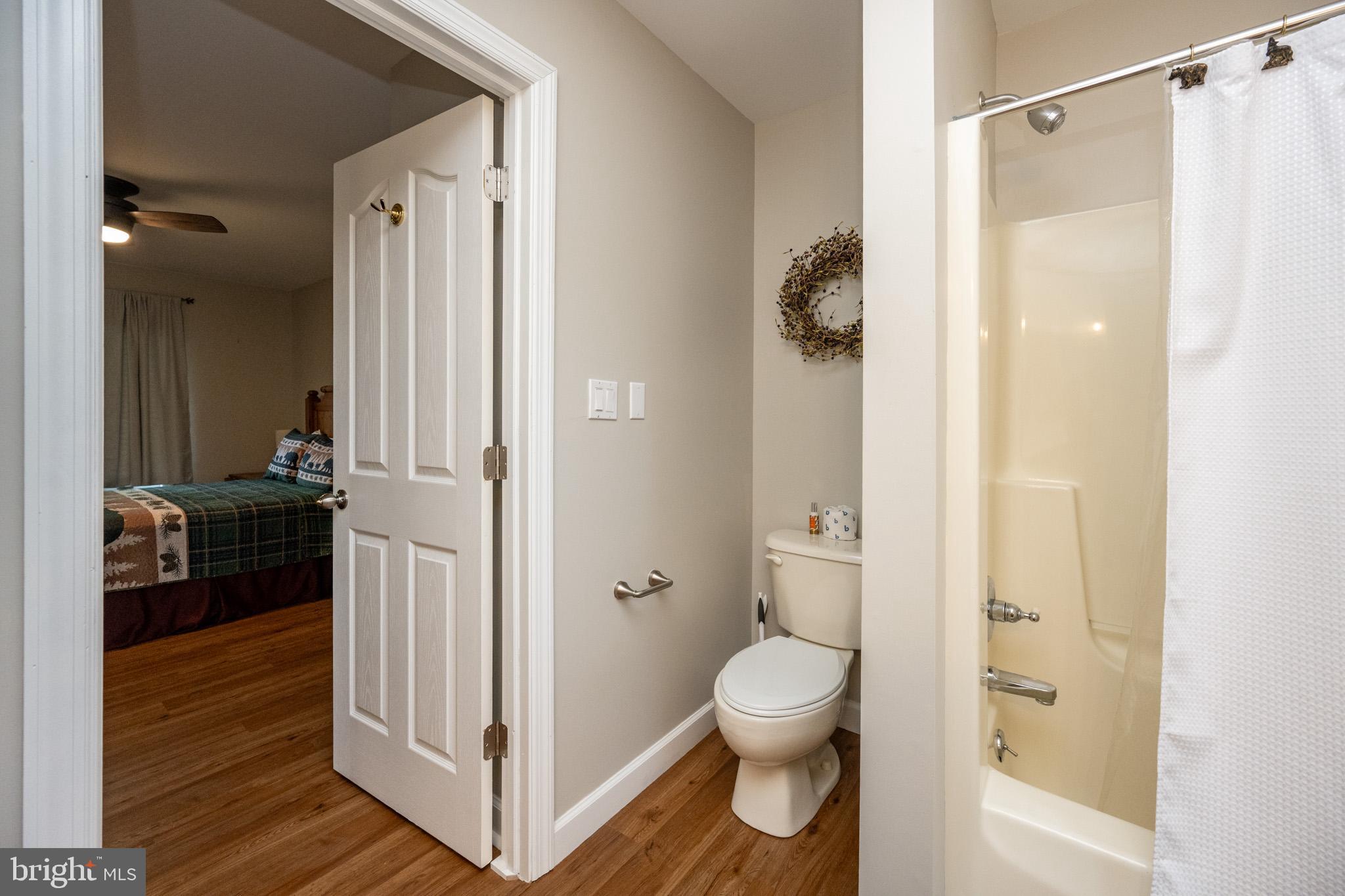 201 Rock Lodge Road McHenry, MD 21541 - Photo 31 of 75 a bathroom with a shower and a toilet