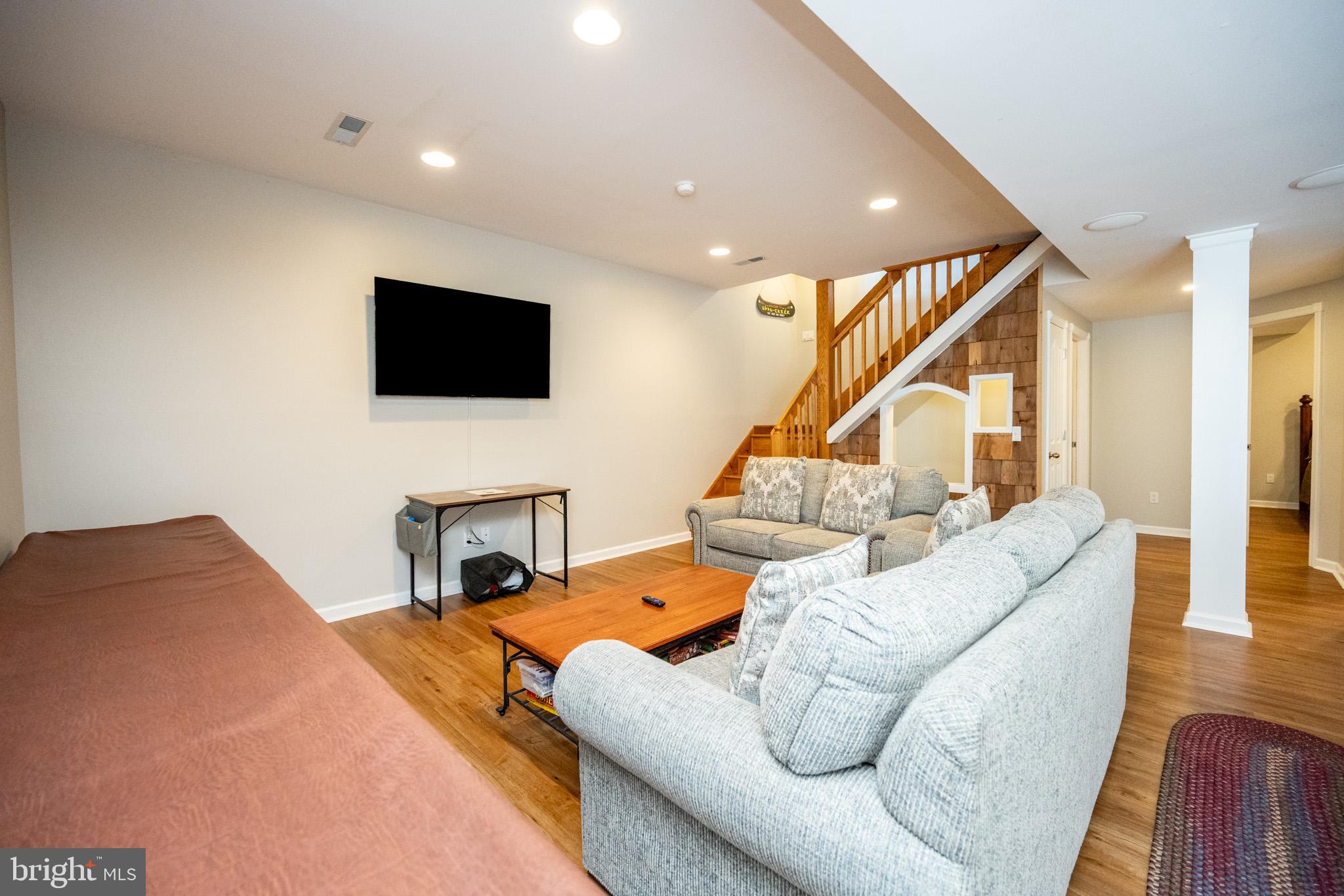 201 Rock Lodge Road McHenry, MD 21541 - Photo 42 of 75 a living room with furniture and a flat screen tv