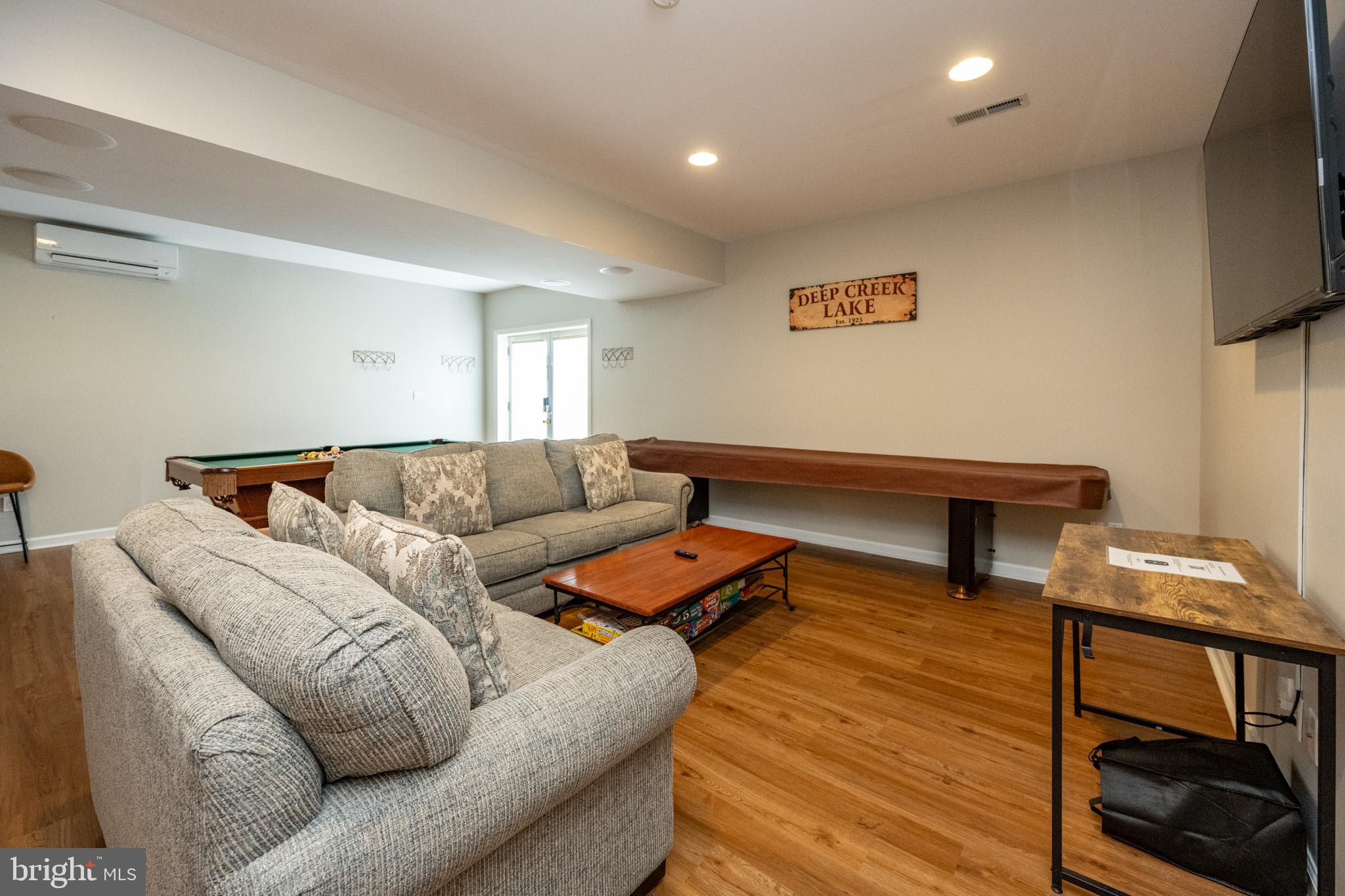 201 Rock Lodge Road McHenry, MD 21541 - Photo 44 of 75 a living room with furniture and a flat screen tv