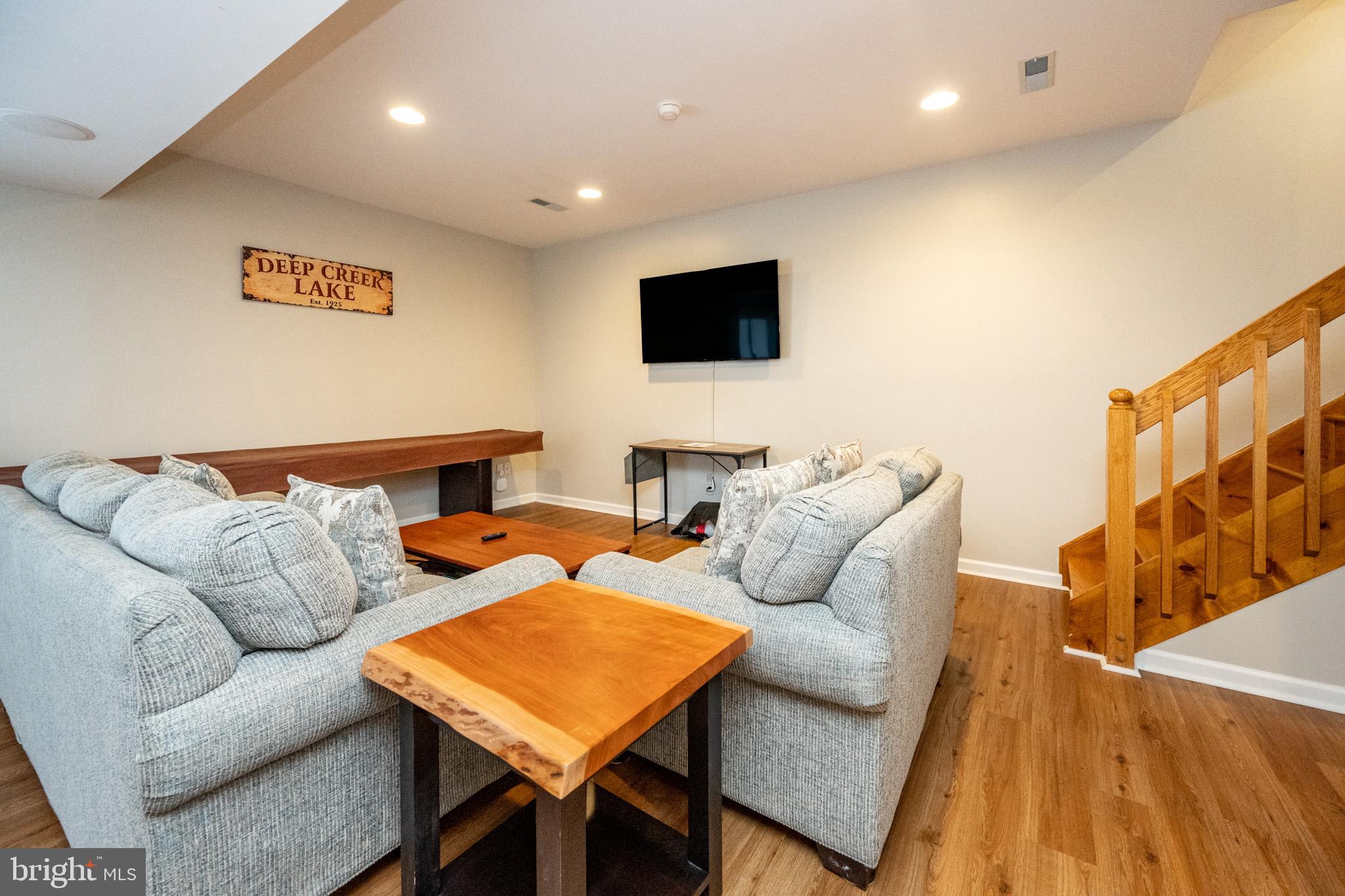 201 Rock Lodge Road McHenry, MD 21541 - Photo 45 of 75 a living room with furniture and a flat screen tv