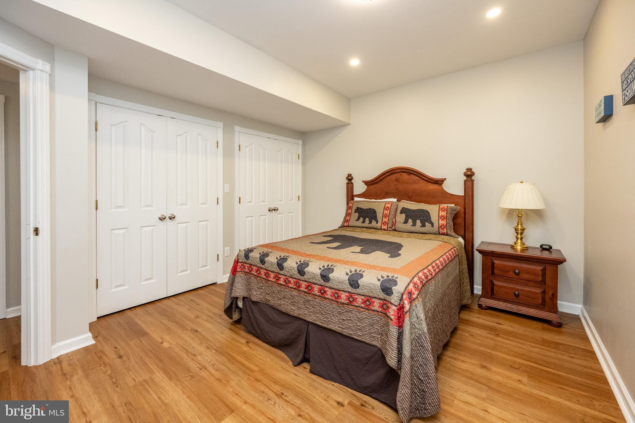 201 Rock Lodge Road McHenry, MD 21541 - Photo 50 of 75 a bedroom with a bed and wooden floor