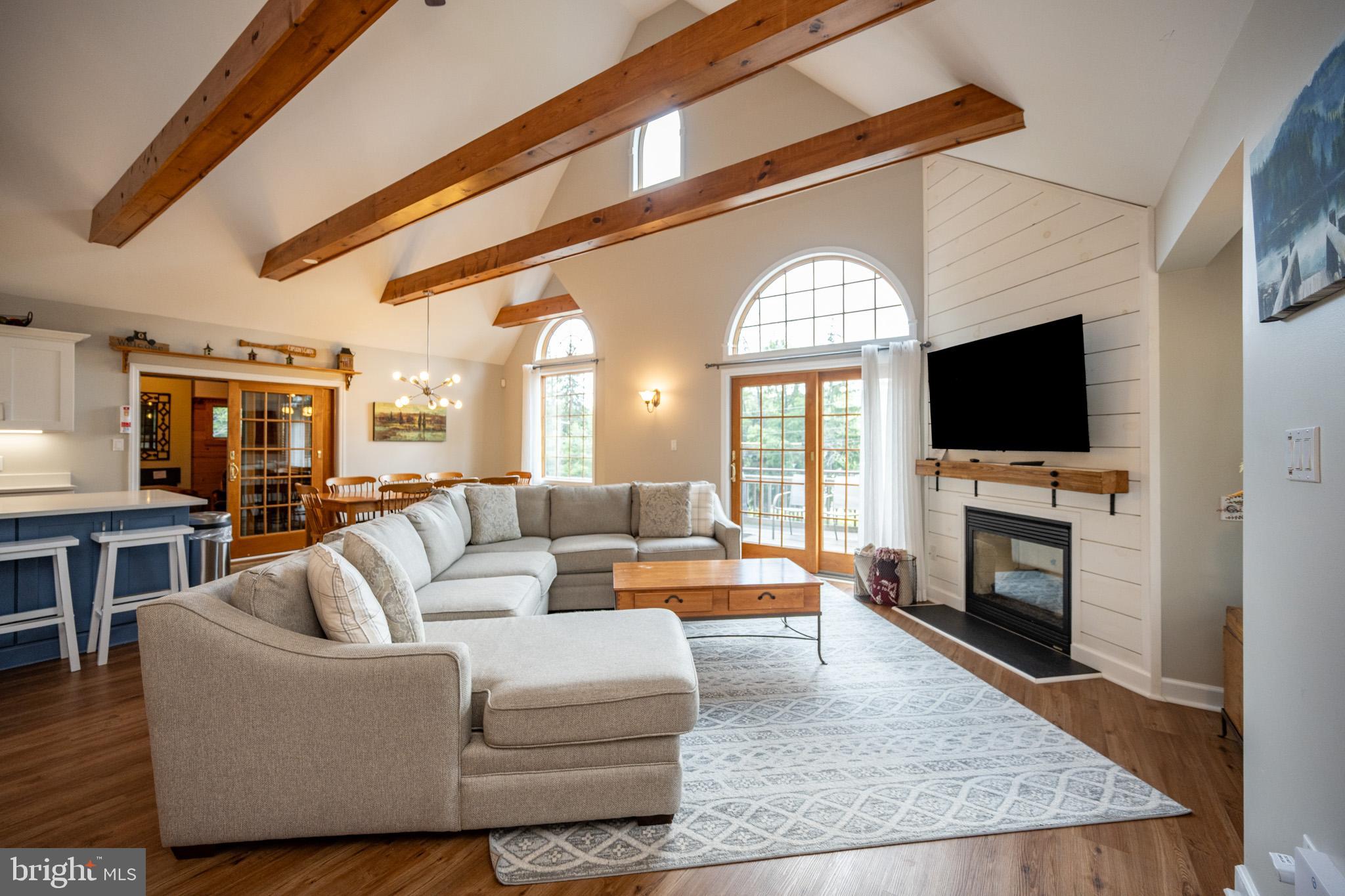 201 Rock Lodge Road McHenry, MD 21541 - Photo 8 of 75 a living room with fireplace furniture and a flat screen tv