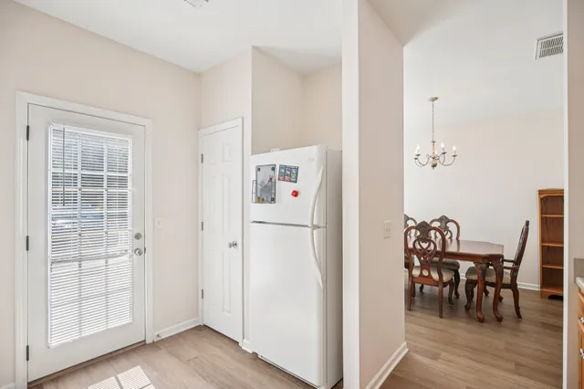 a view of kitchen with furniture and wooden floor