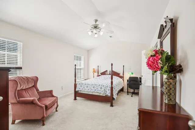 a bedroom with furniture and a chandelier