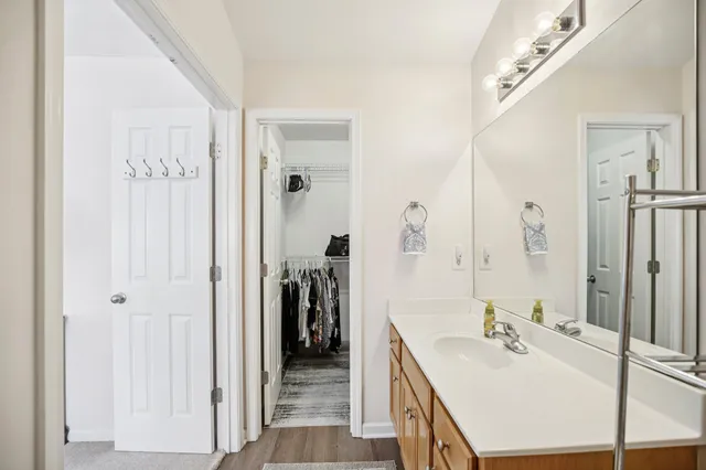a en suite bathroom with a sink and a mirror