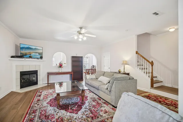 a living room with furniture and a fireplace
