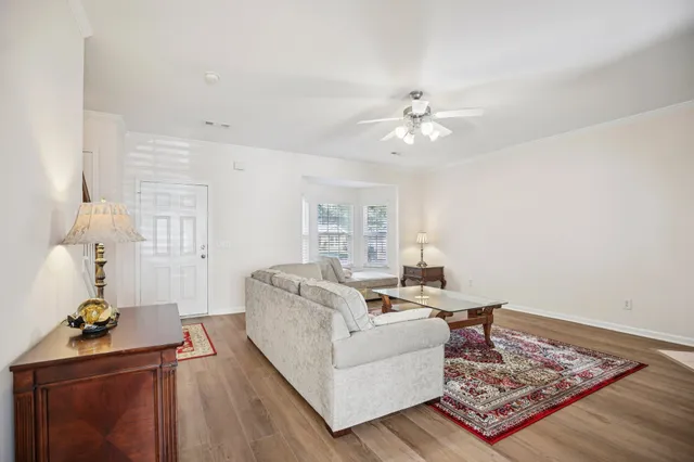 a living room with furniture and a rug