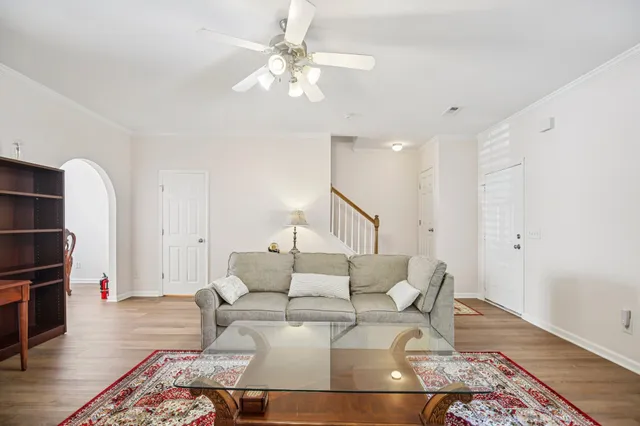 a living room with furniture and a rug