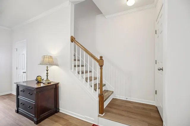 a view of an entryway with wooden floor