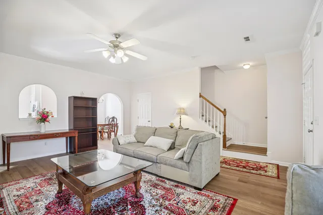 a living room with furniture and a rug