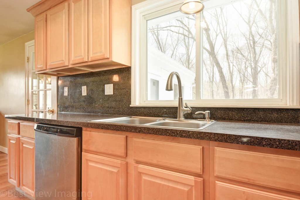 59 Amor Road Milton, MA 02186 - Photo 15 of 29 a kitchen with granite countertop a sink and a window