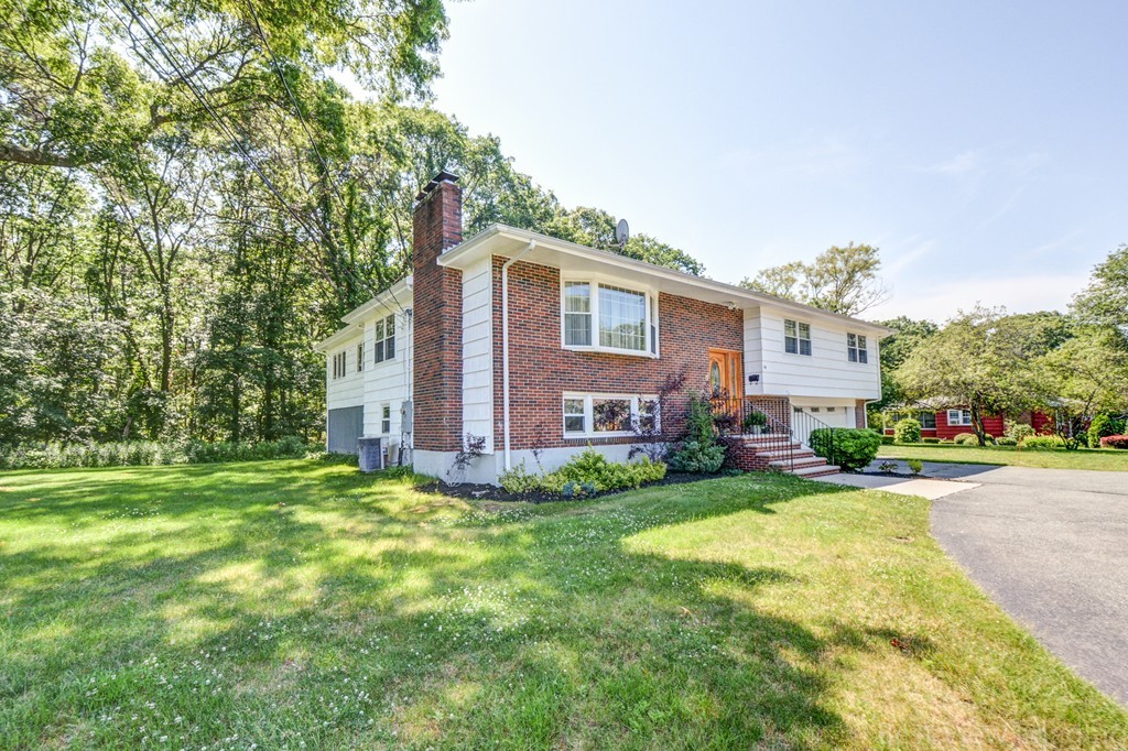 59 Amor Road Milton, MA 02186 - Photo 2 of 29 a view of a house with backyard and garden