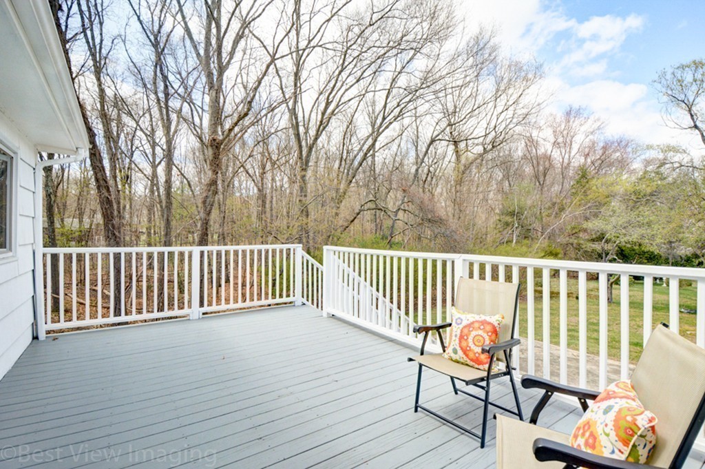 59 Amor Road Milton, MA 02186 - Photo 27 of 29 a view of a wooden deck with a bench