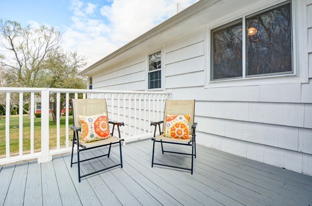 59 Amor Road Milton, MA 02186 - Photo 28 of 29 a outdoor view with a bench and wooden floor