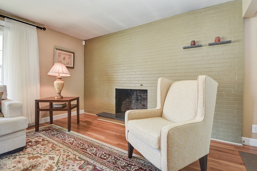59 Amor Road Milton, MA 02186 - Photo 6 of 29 a living room with furniture and a fireplace