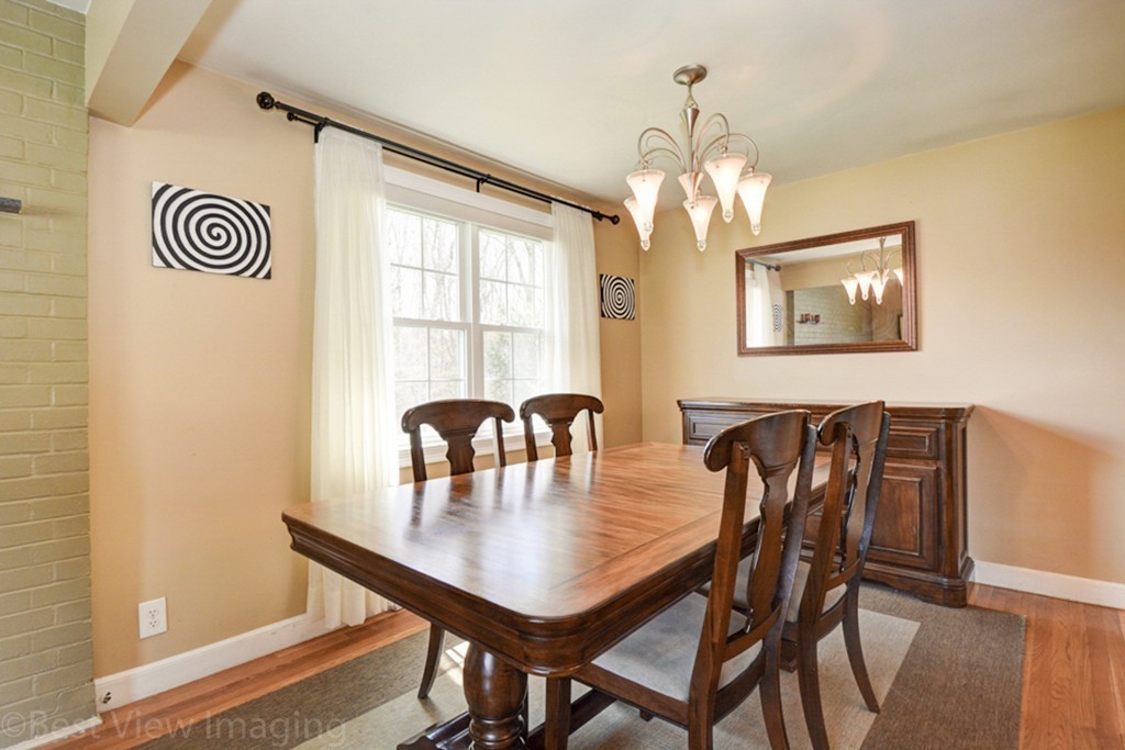 59 Amor Road Milton, MA 02186 - Photo 9 of 29 a view of a dining room with furniture and chandelier