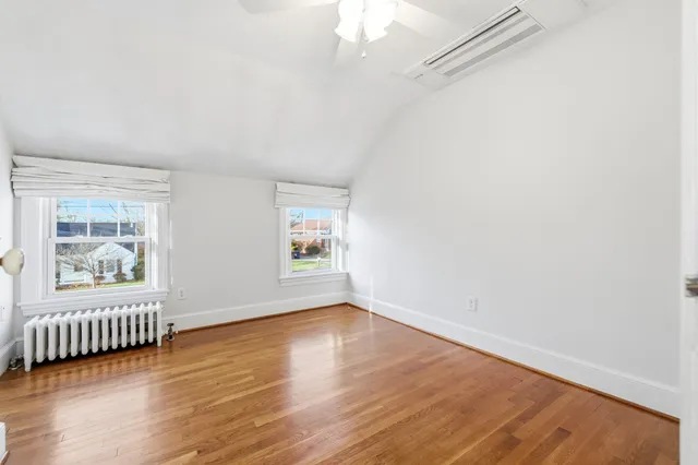 a bathroom with a toilet a sink and a window