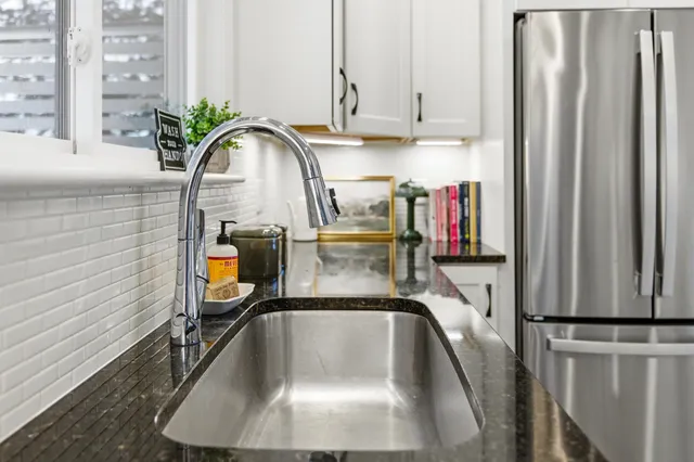 a kitchen with a sink and cabinets