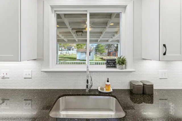 a kitchen with a stove and a table
