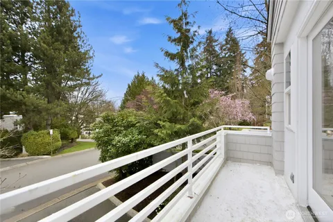 a view of balcony and yard