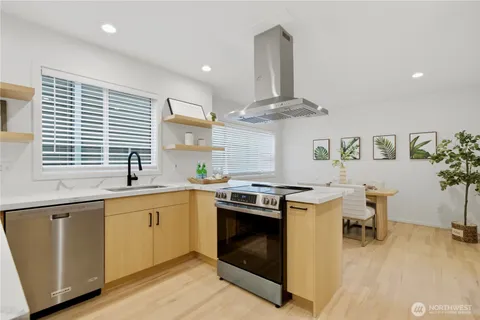 a kitchen with a stove and a sink