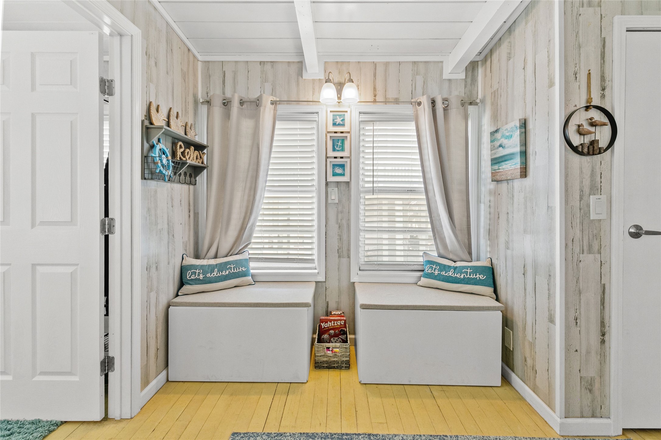 321 Pompano Lane Surfside Beach, TX 77541 - Photo 12 of 36 a view of a hallway with entryway wooden floor and front door