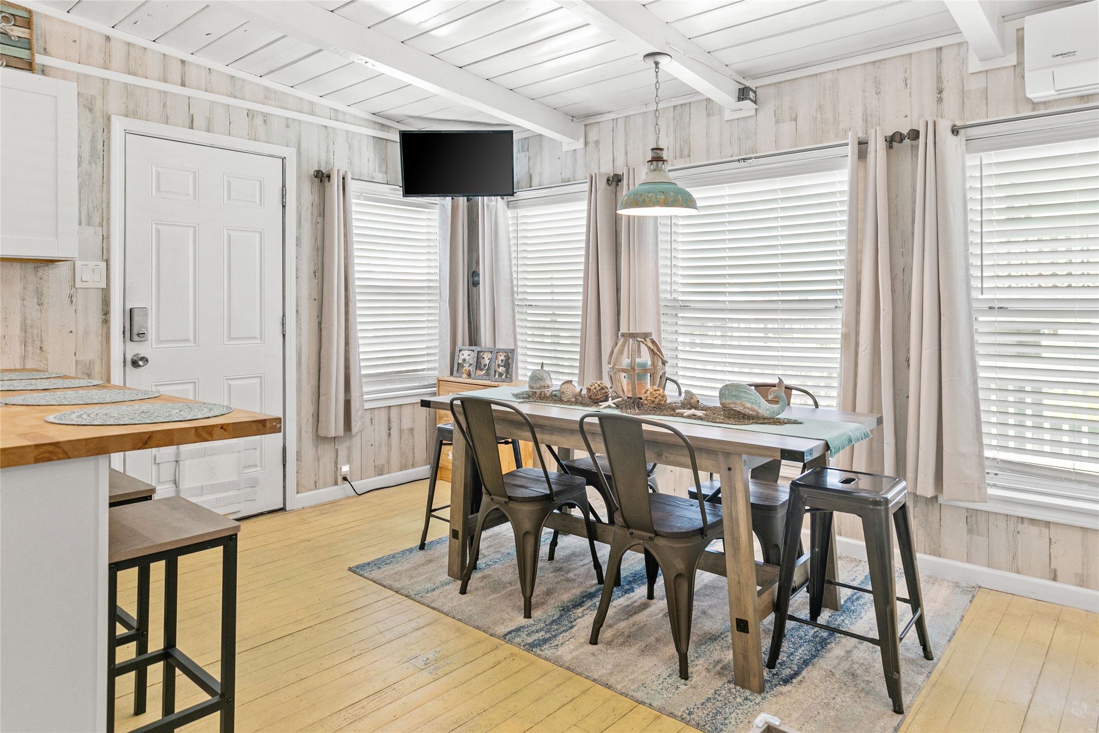 321 Pompano Lane Surfside Beach, TX 77541 - Photo 15 of 36 a view of a dining room with furniture window and wooden floor
