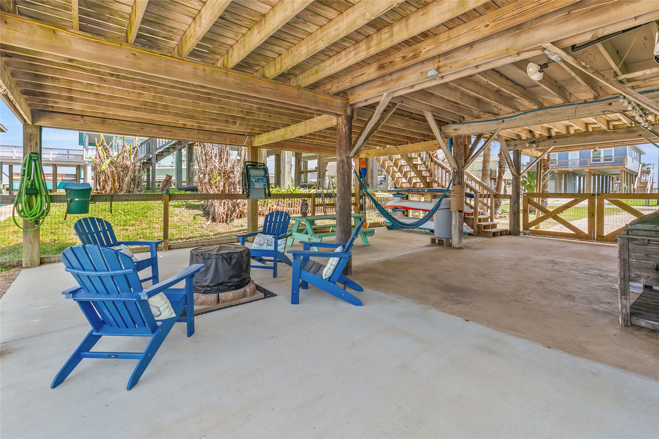 321 Pompano Lane Surfside Beach, TX 77541 - Photo 5 of 36 a view of a patio with a table and chairs