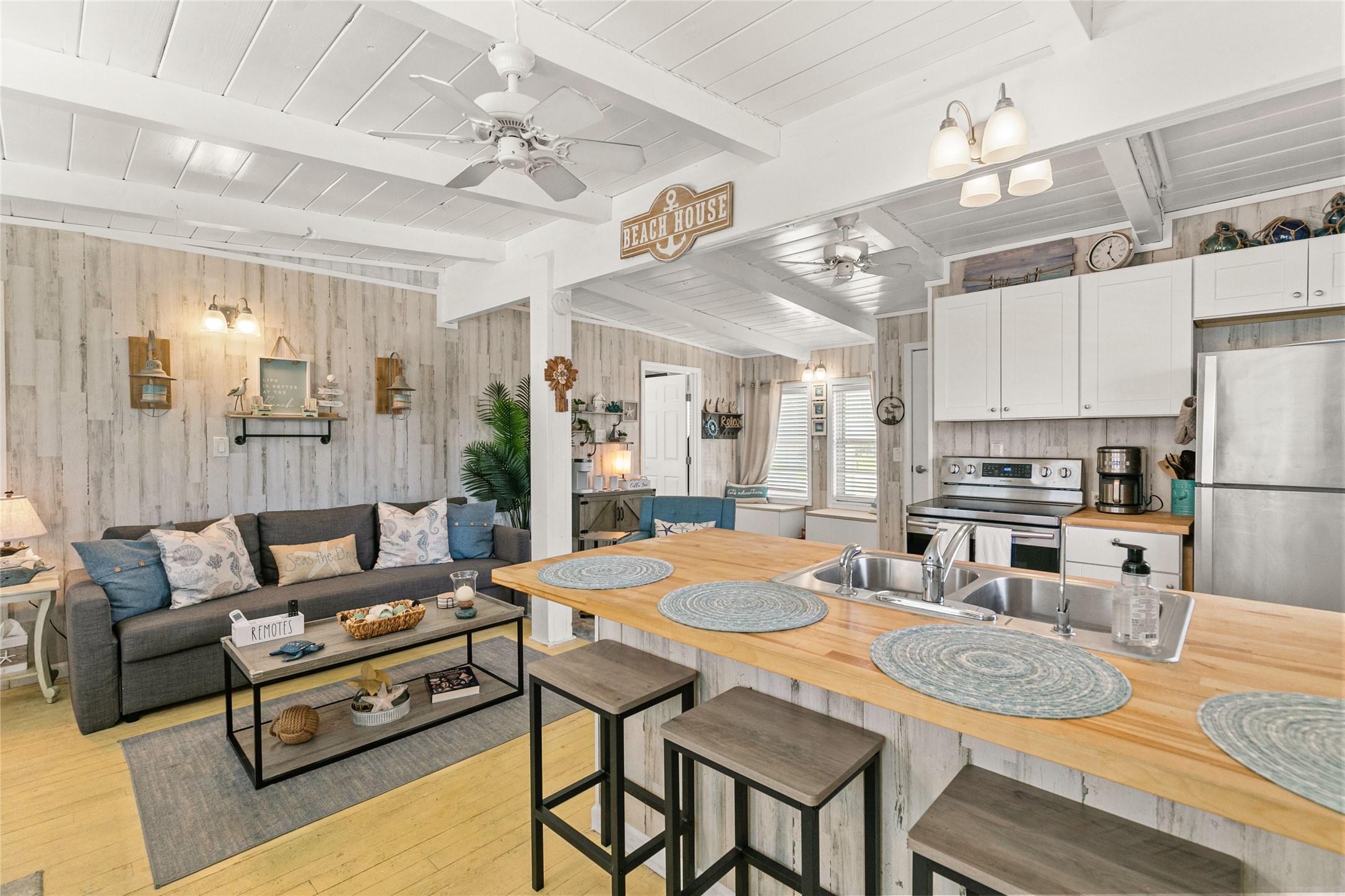 321 Pompano Lane Surfside Beach, TX 77541 - Photo 8 of 36 a living room with stainless steel appliances furniture a dining table and kitchen view