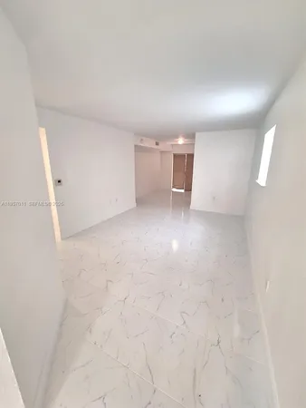 en empty room with windows