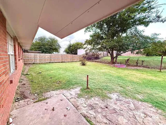 a view of a backyard with a garden