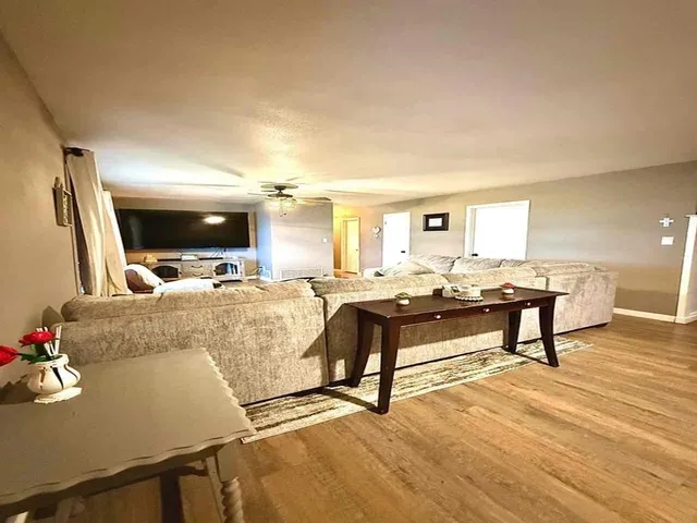 a living room with furniture and a flat screen tv