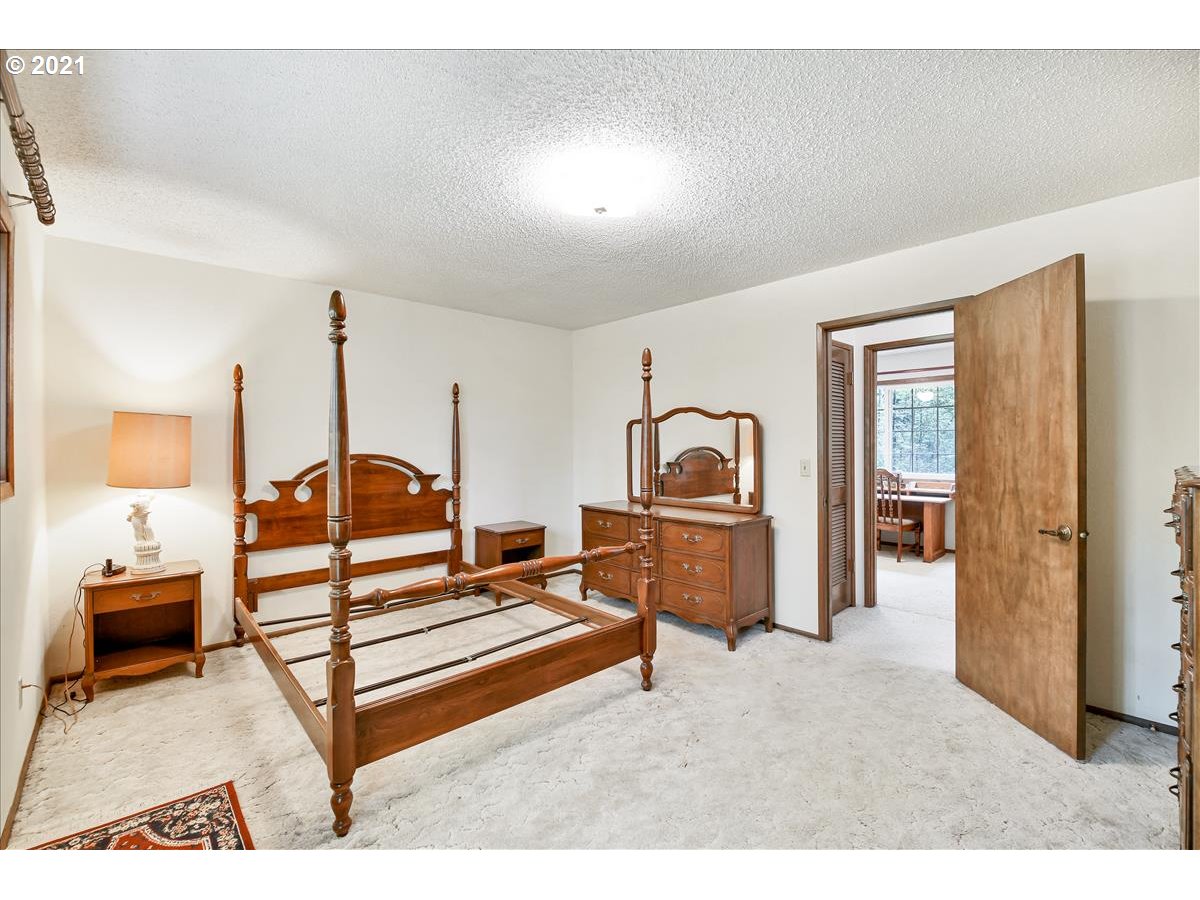 50625 Southeast Baty Road Sandy, OR 97055 - Photo 22 of 32 a bedroom with furniture and window