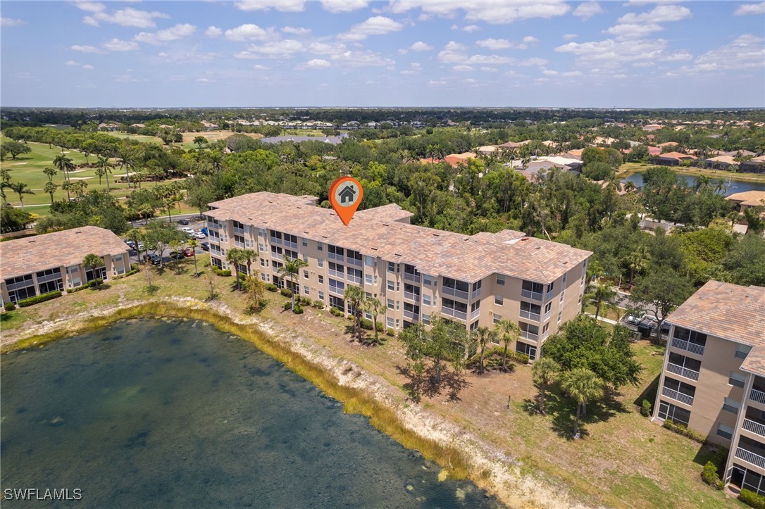 8550 Kingbird Loop, Unit 637 Estero, FL 33967 - Photo 11 of 35 an aerial view of a house with a lake view