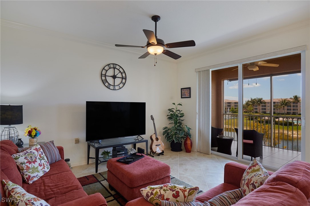 8550 Kingbird Loop, Unit 637 Estero, FL 33967 - Photo 15 of 35 a living room with furniture and a flat screen tv