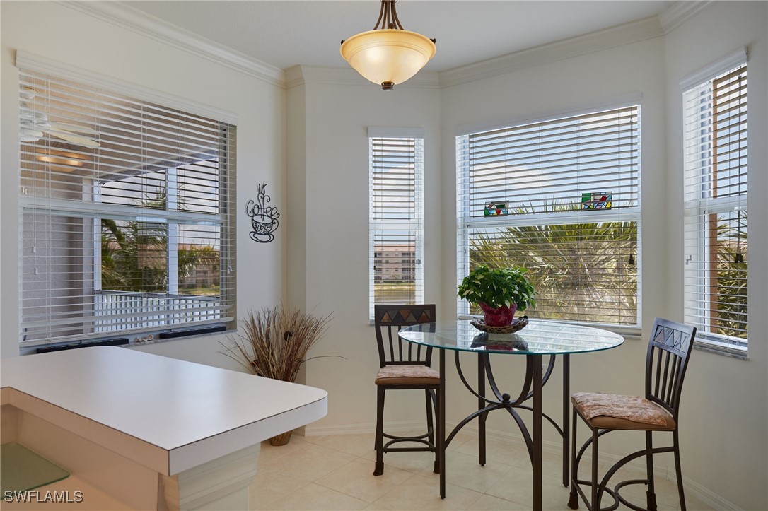 8550 Kingbird Loop, Unit 637 Estero, FL 33967 - Photo 20 of 35 a view of a dining room with furniture and window