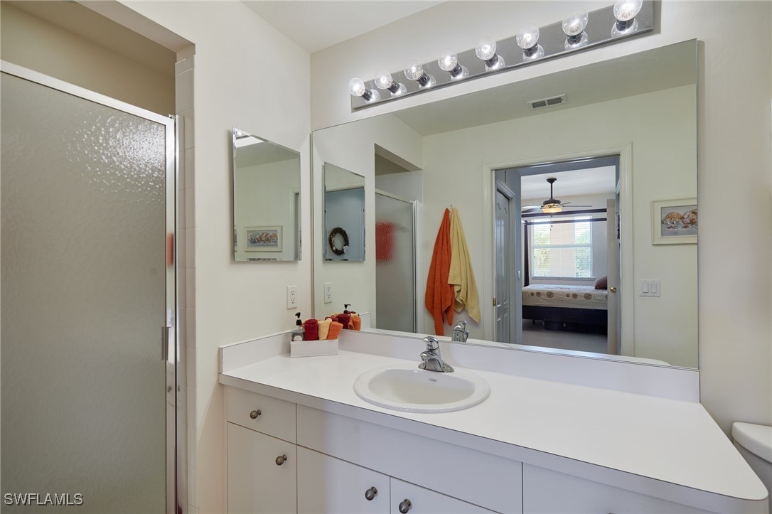 8550 Kingbird Loop, Unit 637 Estero, FL 33967 - Photo 23 of 35 a bathroom with a sink and a mirror