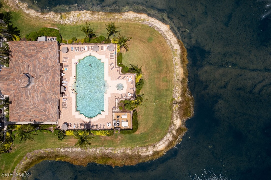 8550 Kingbird Loop, Unit 637 Estero, FL 33967 - Photo 30 of 35 an aerial view of a house with a yard swimming pool and outdoor seating
