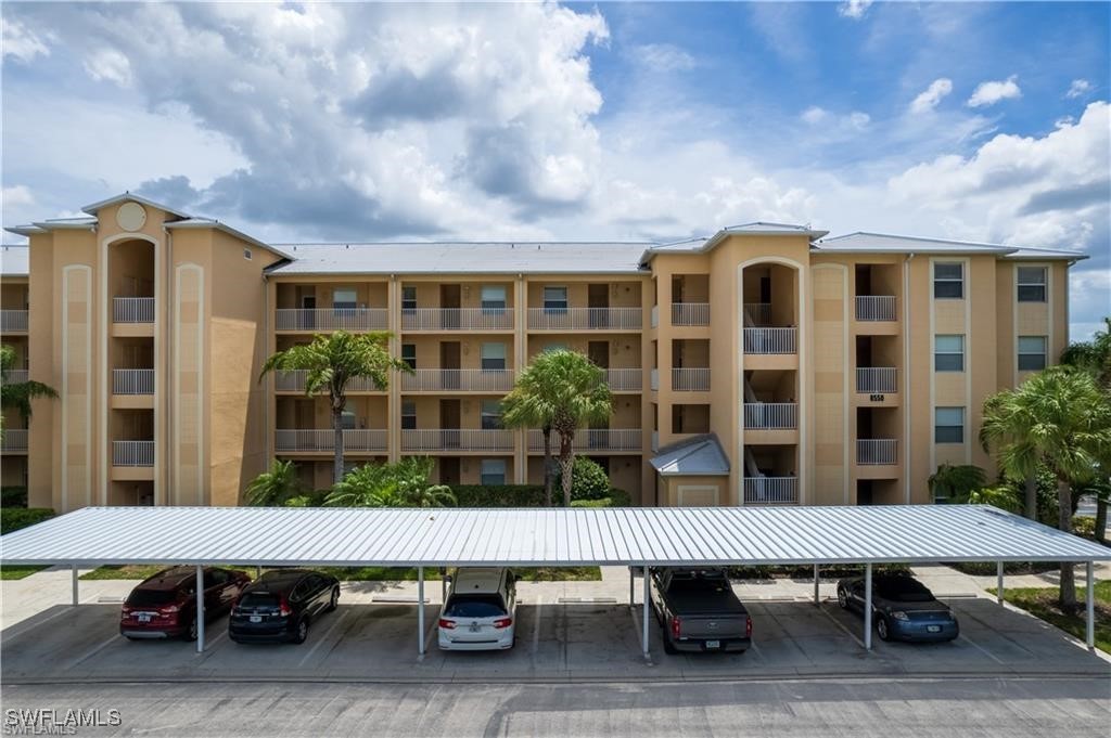 8550 Kingbird Loop, Unit 637 Estero, FL 33967 - Photo 3 of 35 a view of a patio with a table and chairs