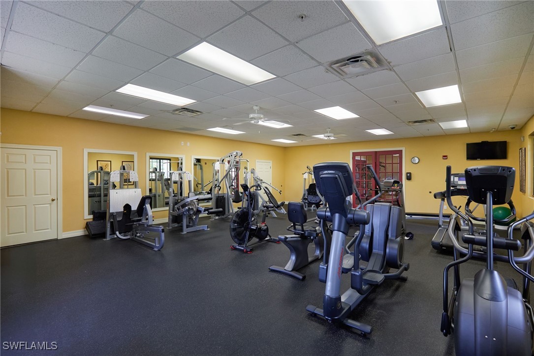 8550 Kingbird Loop, Unit 637 Estero, FL 33967 - Photo 32 of 35 a view of a room with gym equipment