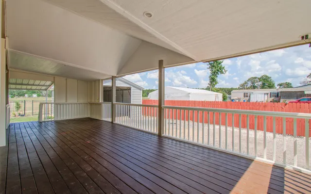 a view of hallway with wooden floor