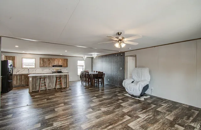 a view of a dining room with furniture and chandelier
