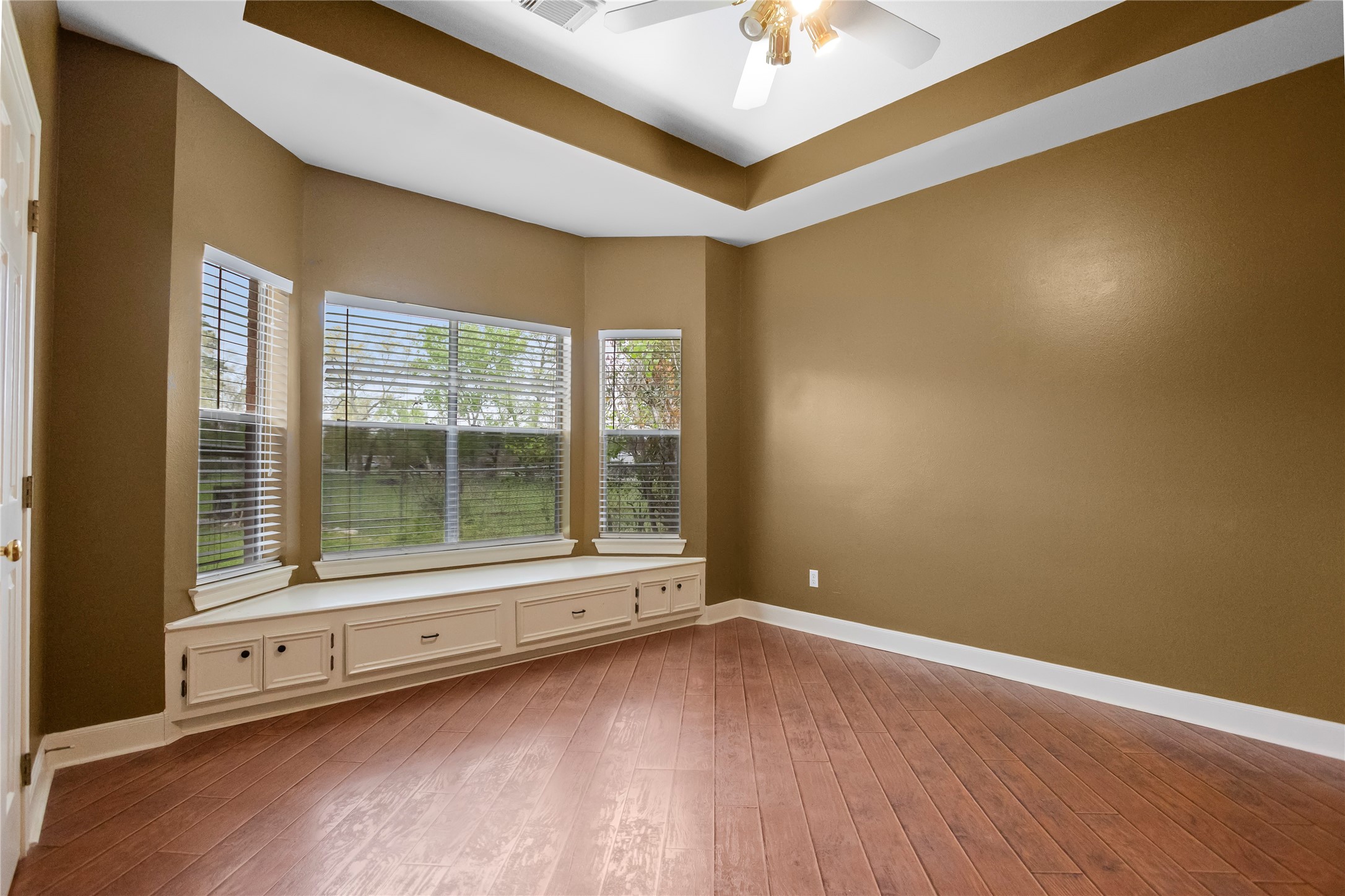 22916 East Martin Drive Porter, TX 77365 - Photo 30 of 43 a view of an empty room with a window and wooden floor