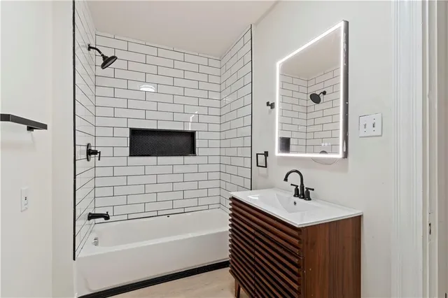 a bathroom with a sink and a bathtub
