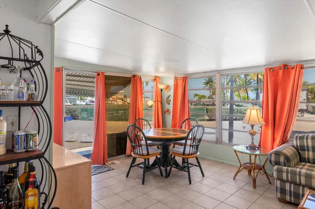 a dining room with furniture fire place and a chandelier