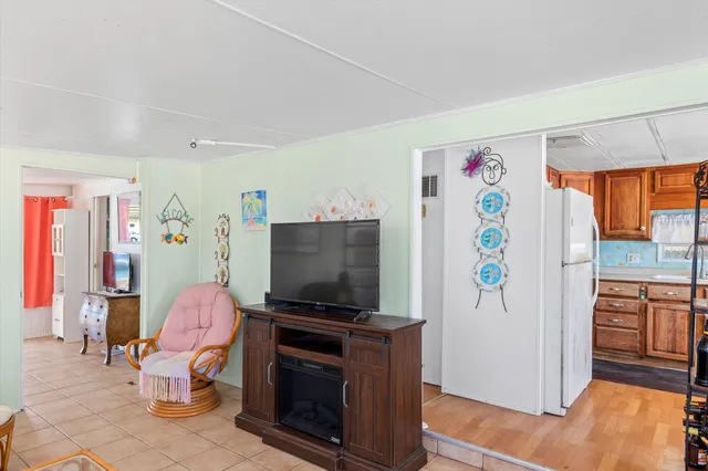 a living room with furniture and flat screen tv