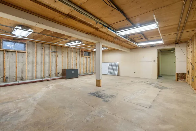 a dining room with furniture window and outside view