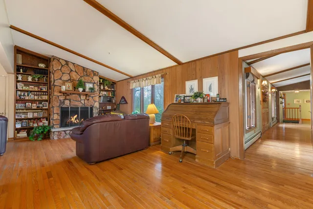 a view of a livingroom with furniture and a flat screen tv
