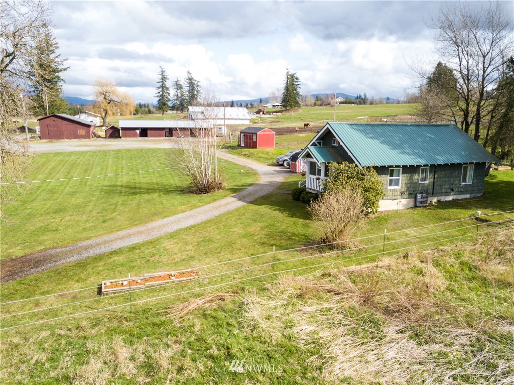 5574 E Road Bellingham, WA 98226 - Photo 1 of 25 a view of an swimming pool with a yard